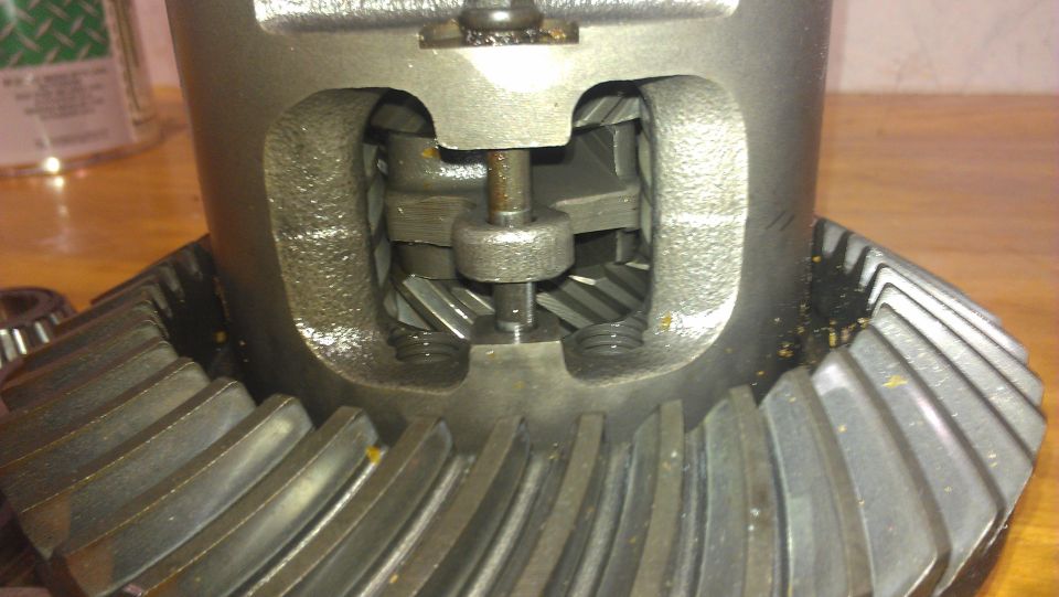 Close-up of differential gears with visible teeth and internal mechanisms