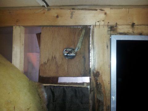 1986 Ford Bronco - Unfinished interior construction shows exposed wiring and rough wooden beams.