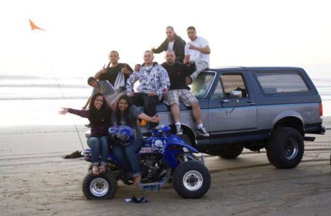1987 Ford Bronco - Group of friends with a Ford Bronco and ATV on the beach.