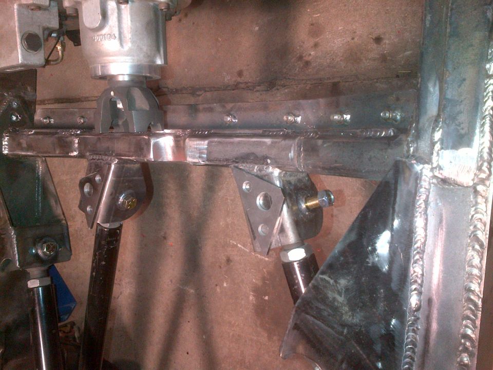 Custom suspension components with welds and bolts, close-up view