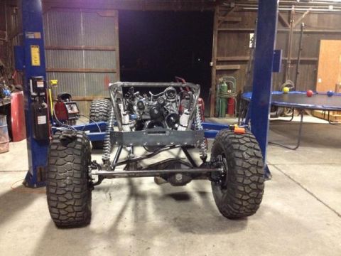 1985 Jeep CJ7 - This Jeep CJ7 chassis is undergoing a build, with the engine and suspension components visible.