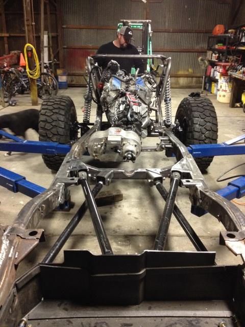 1985 Jeep CJ7 - Custom off-road vehicle chassis assembly in progress, showing engine and suspension.
