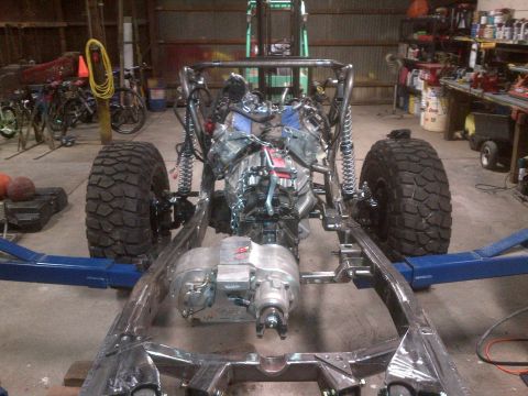 1985 Jeep CJ7 - Custom Jeep CJ frame undergoing build with engine and transmission assembly.