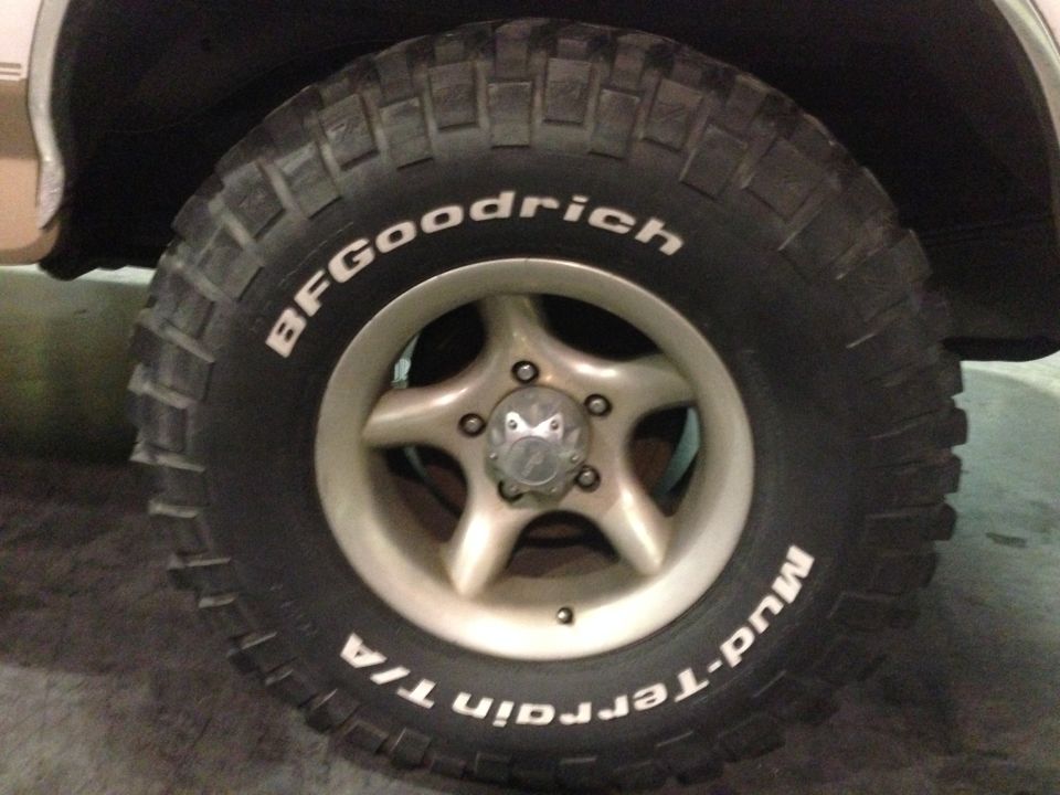 BFGoodrich Mud-Terrain T/A tire on a 5-spoke wheel with a Supermotors logo at the bottom right