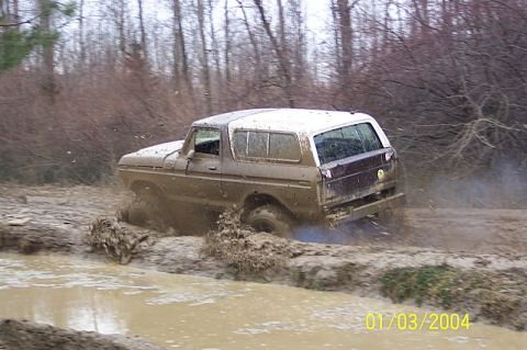 1978 Ford Bronco - Ford Bronco tackles a challenging muddy off-road course.
