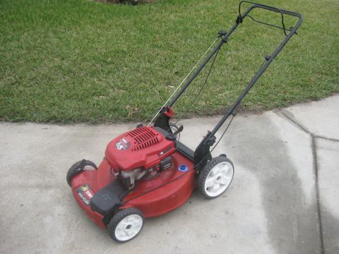2006 Honda RANCHER - Red Toro Recycler lawn mower with a 6.5 HP engine is shown from the front-left angle.