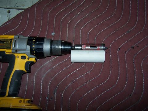 1990 Ford Bronco - A hunk of PVC cut to length for a cheap stop for the hole saw to drill out the corners.
