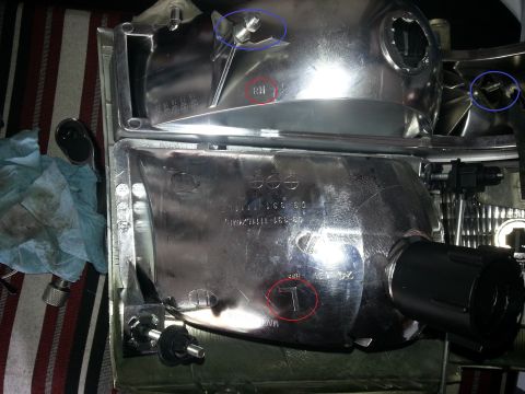 1994 Ford Bronco - Close-up of a vehicle headlight assembly, showing part numbers and directional markings.