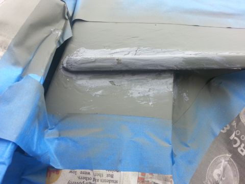 1992 Ford Bronco - Bodywork repair in progress, with masking tape applied to protect surrounding areas.