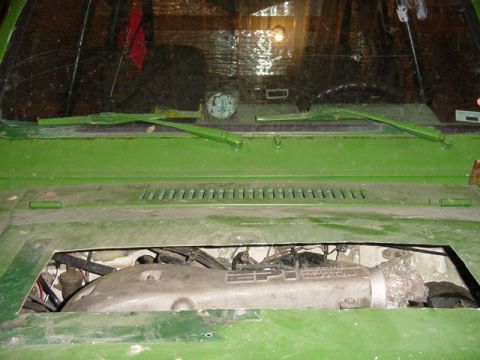 1992 Ford Bronco - The engine bay of a green vehicle, showing the intake manifold with an 'EFI' label.