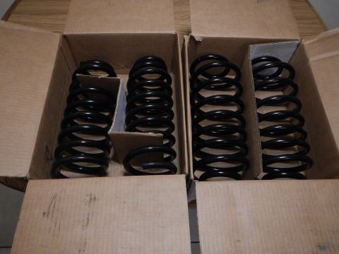 2003 Ford Crown Victoria - New suspension springs are packaged in cardboard boxes, ready for installation.