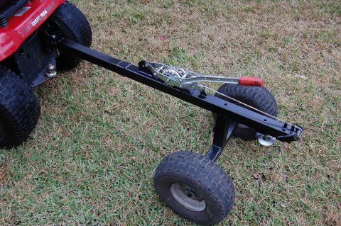 2006 Honda RANCHER - Lawn tractor hitch attachment with trailer wheels shown from the rear.