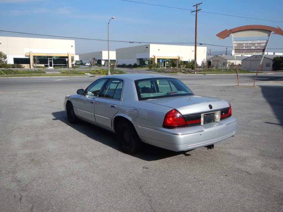 2002 Mercury Grand Marquis parked in a lot, rear view