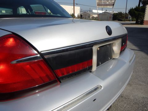 2002 Mercury Grand Marquis - Silver 2002 Mercury Grand Marquis rear end detail with chrome trim and black accent panel.