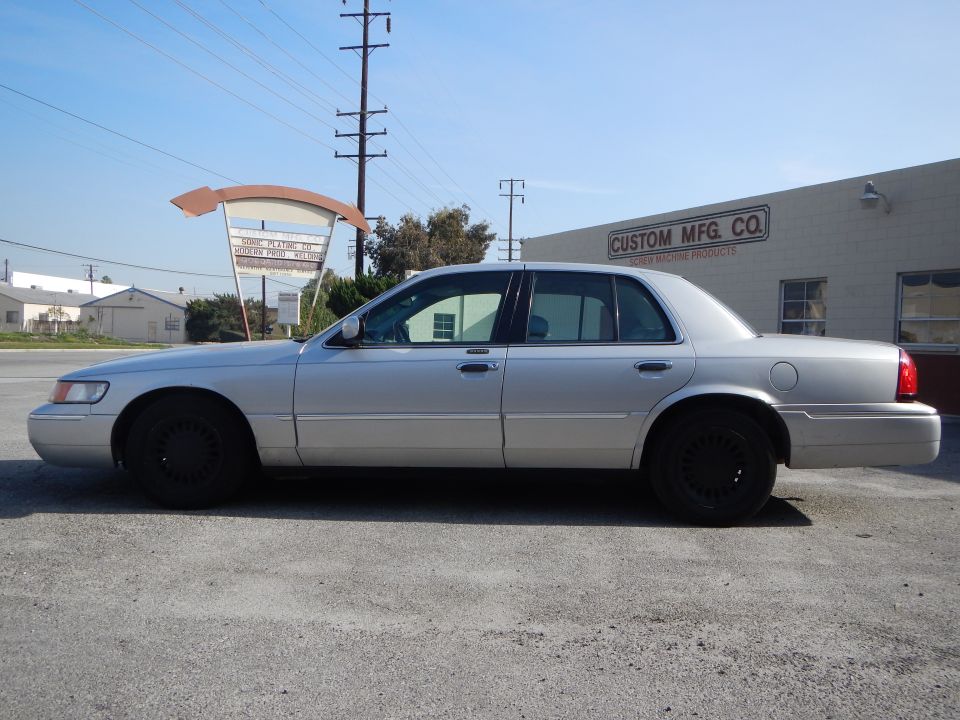 Silver 2002 Mercury Grand Marquis sedan, side view