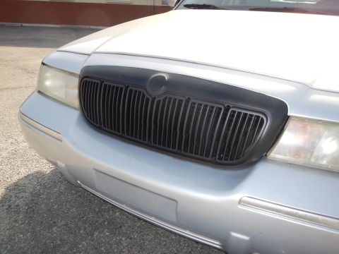 2002 Mercury Grand Marquis - Front view of a silver 2002 Mercury Grand Marquis showing its black grille and headlights.