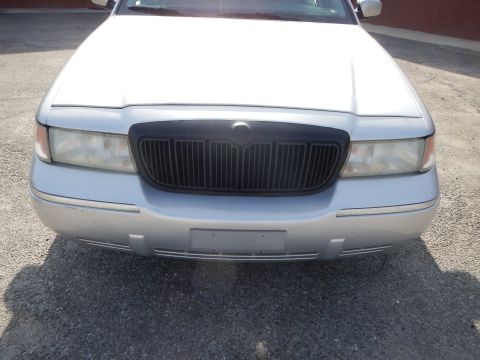 2002 Mercury Grand Marquis - The front of a silver Mercury Grand Marquis is shown, a black grille and chrome accents.