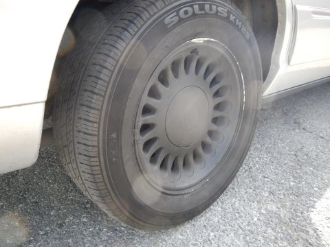 2002 Mercury Grand Marquis - The image shows a close-up of a car's wheel and tire, specifically a Solus KH25 tire.