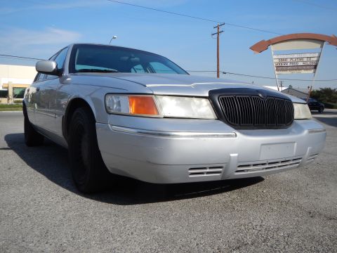 2002 Mercury Grand Marquis - Front 3/4 view of a silver 2002 Mercury Grand Marquis parked outdoors.