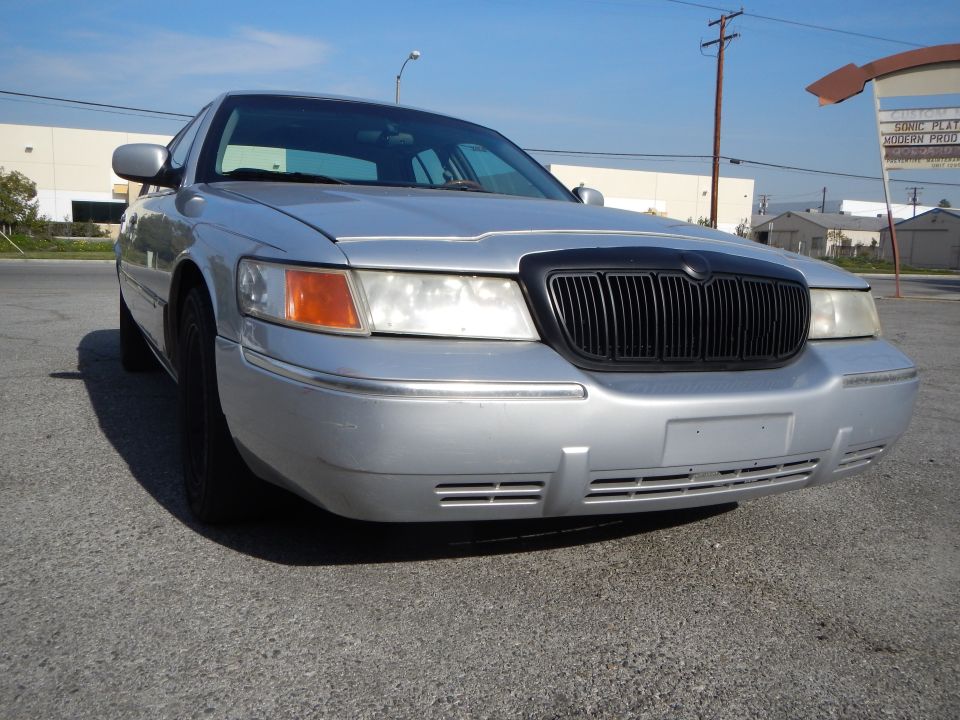 Silver 2002 Mercury Grand Marquis front view, parked on asphalt