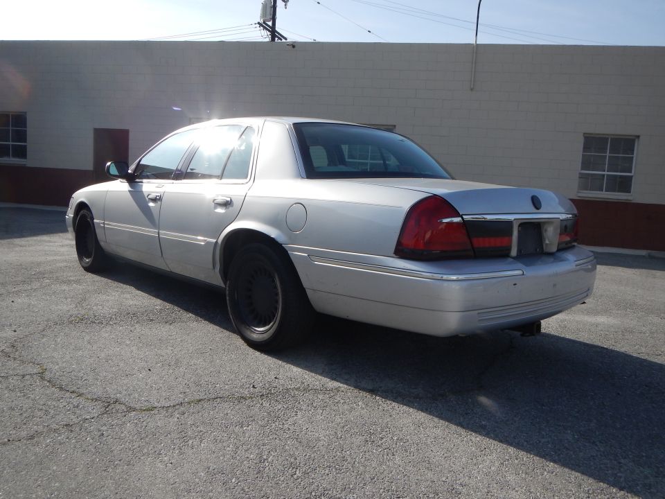 2002 Mercury Grand Marquis, rear 3/4 view, silver