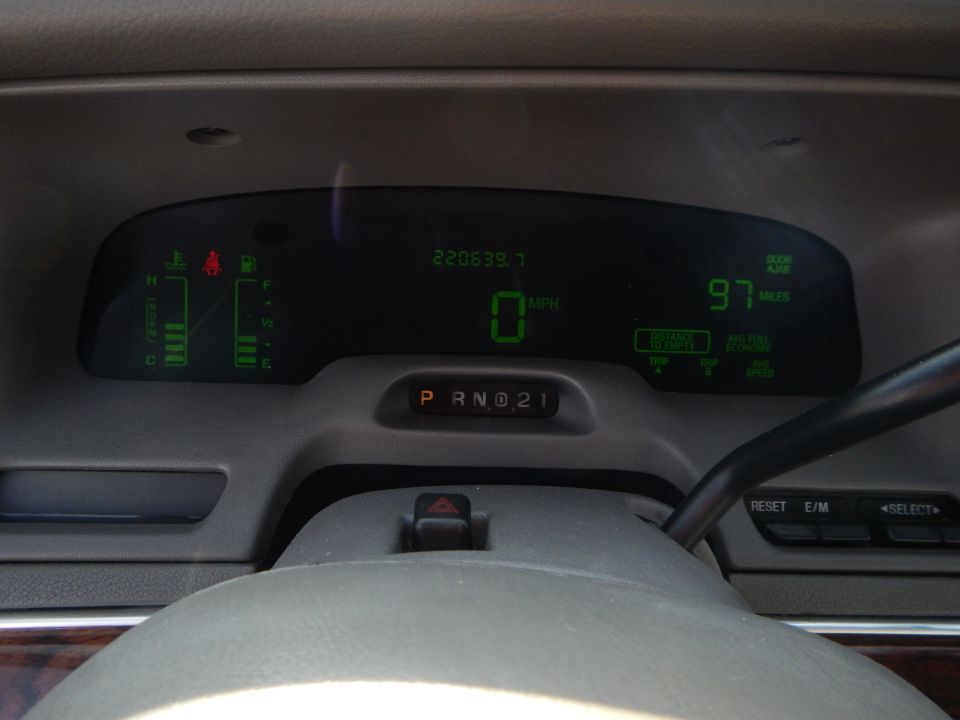 Digital dashboard showing odometer reading 220639.7, 0 MPH, 97 miles, and gear selector in Park