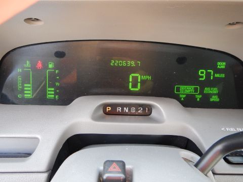 2002 Mercury Grand Marquis - The digital dashboard displays show the vehicle is stationary with 0 MPH and over 220,000 miles.