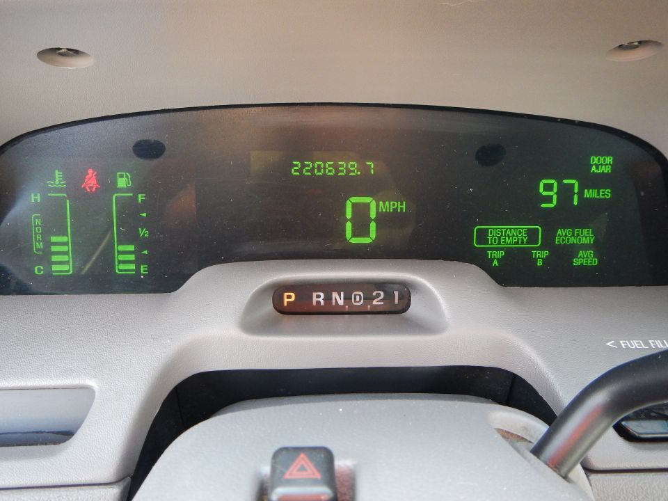 Dashboard gauges showing 220639.7 miles, 0 MPH, and P R N D 2 1 gear selection