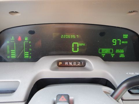 2002 Mercury Grand Marquis - The digital dashboard displays the vehicle's speed, odometer reading, fuel level, and other driving information.