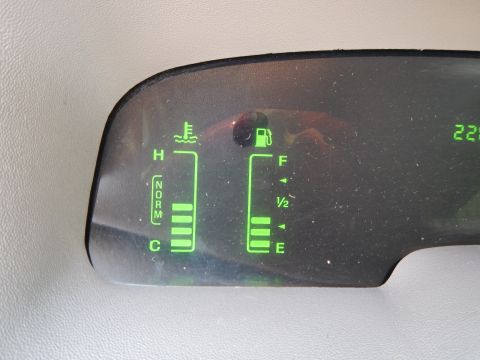 2002 Mercury Grand Marquis - Interior view of dashboard gauges displaying fuel and engine temperature readings.