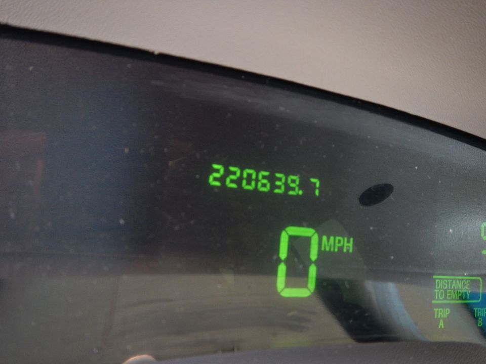 Digital odometer showing 220639.7 miles and speedometer showing 0 MPH