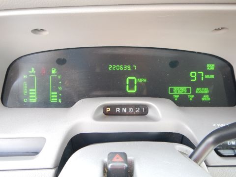 2002 Mercury Grand Marquis - Interior view of a car's digital dashboard with odometer, speed, and fuel level displayed.
