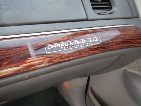 2002 Mercury Grand Marquis - The interior trim displays 'GRAND MARQUIS LS PrecisionTrac' badging, confirming the vehicle's identity.