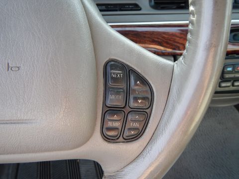 2002 Mercury Grand Marquis - Steering wheel controls for audio and climate functions are visible in the vehicle's interior.