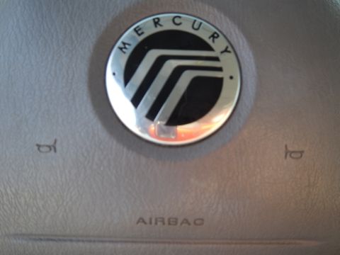 2002 Mercury Grand Marquis - The Mercury emblem is visible on the airbag cover of the steering wheel.
