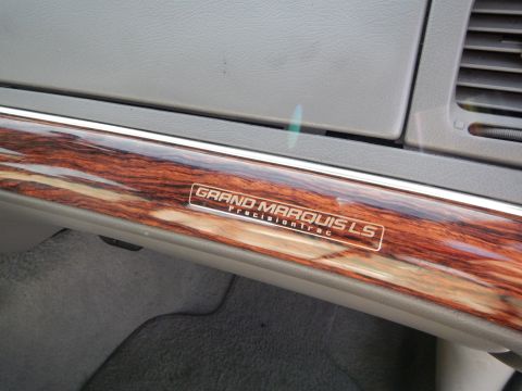 2002 Mercury Grand Marquis - Close-up of interior trim with a 'Grand Marquis LS PrecisionTrac' badge.