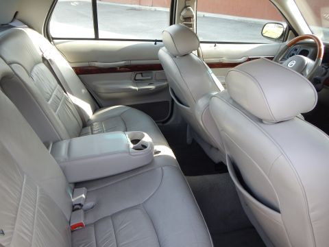 2002 Mercury Grand Marquis - Interior view of a 2002 Mercury Grand Marquis, highlighting the spacious rear seating and dashboard details.