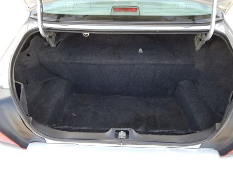 2002 Mercury Grand Marquis - The interior of a car's trunk is shown with the lid open, revealing the carpeted storage area.