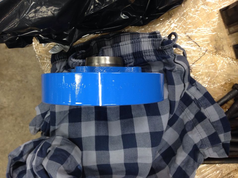 Blue painted engine pulley with visible text