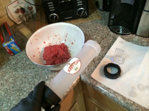 1968 Ford Mustang - Making jerky with a jerky gun, ground meat, and various accessories on a kitchen counter.