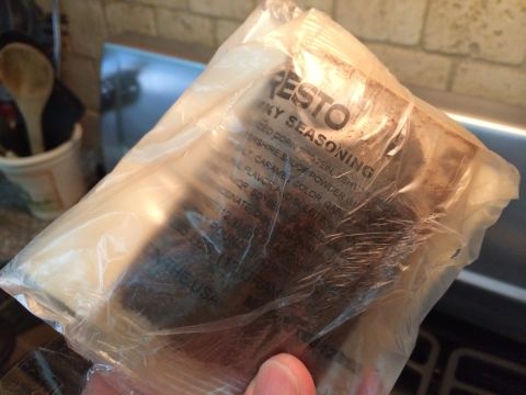 1968 Ford Mustang - A packet of Resto Smoky Seasoning is held in a hand, showing ingredients and branding.