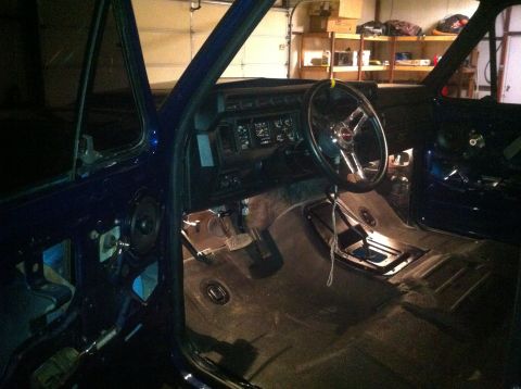 1982 Ford Bronco - The interior of a vehicle is shown, with the dashboard and steering wheel visible.