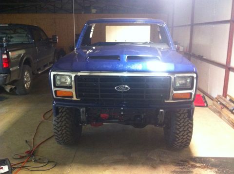 1982 Ford Bronco - This blue Ford Bronco, possibly from the early 1980s, is shown with a custom hood scoop and front bumper.