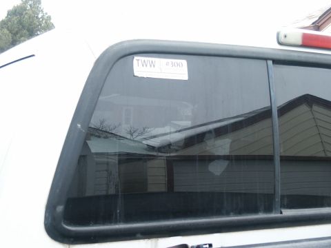 2000 Ford F-250 - A sticker with "TWW #300" is visible on the rear window of a white truck.