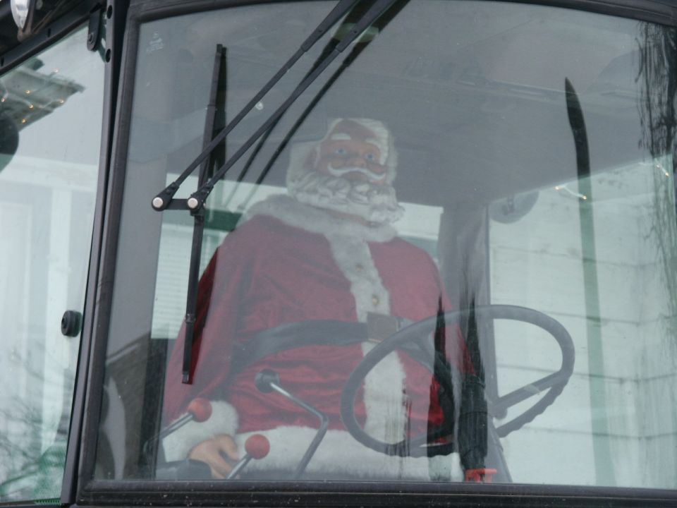 Santa Claus figure behind steering wheel, interior view