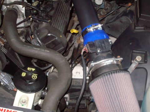 2004 Ford Crown Victoria - Close-up of an engine bay an aftermarket cold air intake system.