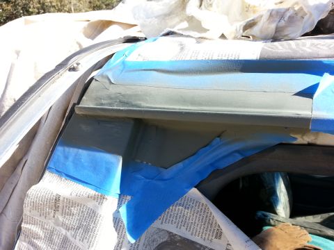 1992 Ford Bronco - Masking tape protects vehicle bodywork during painting of the drip rail area.