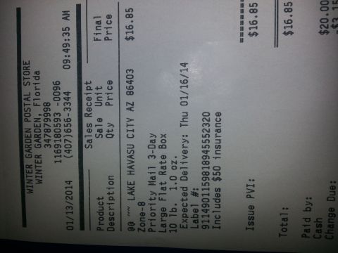 1994 Ford Bronco - Photograph of a USPS postal store sales receipt for a Priority Mail shipment, not a vehicle document.