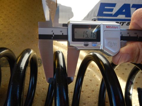 2003 Ford Crown Victoria - Mitutoyo digital caliper reading 15.16 measures a black coil spring, with an Eaton box visible in back.