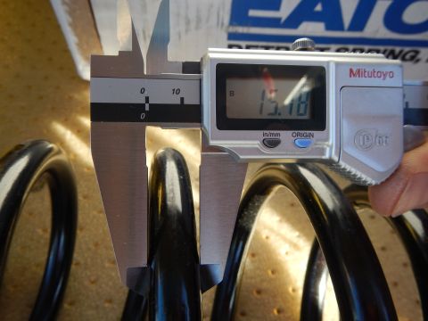 2003 Ford Crown Victoria - Mitutoyo digital caliper showing 15.18 measures a black coil spring near an Eaton Detroit Spring box.